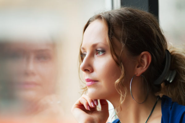 woman being mindful looking out of window